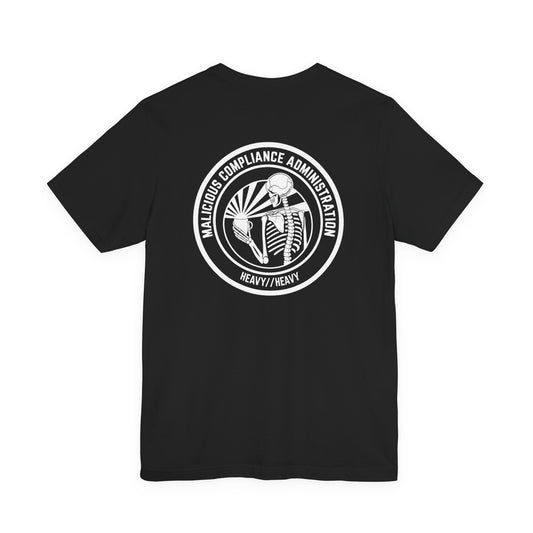 Back of a black Malicious Compliance Administration T-shirt with a white circular skeleton and steaming mug graphic.